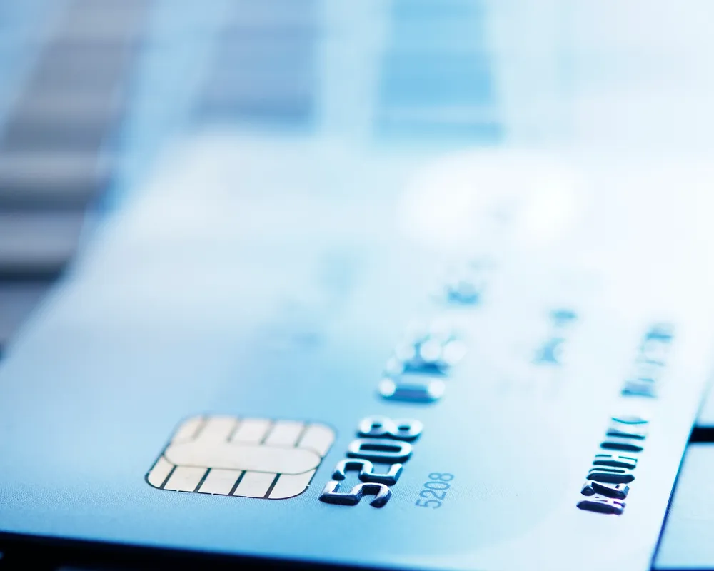 Generic blue image of credit card on a keyboard
